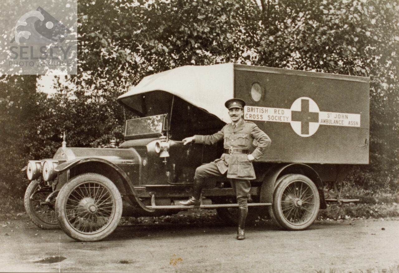 Serviceman poses on Red Cross van - featured image