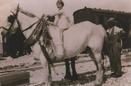 A child on horse pulling railway carriage - thumbnail image