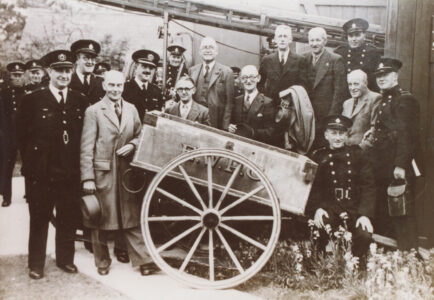 EWPC handcart with servicemen and others - thumbnail image