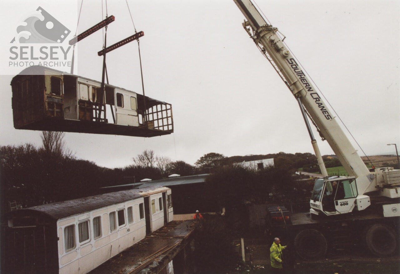 Railway carriages being removed by crane - featured image