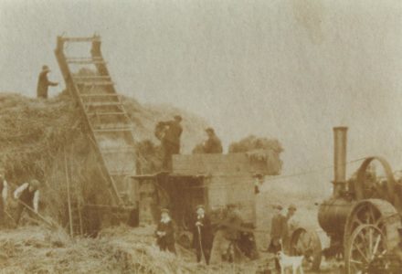 Selsey: Farmers using a steam driven threshing machine - thumbnail image