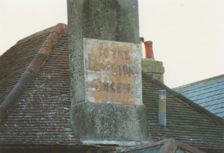 Selsey: Roof and chimney stack with notice on - thumbnail image