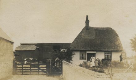 Selsey: A family pose outside a farmhouse - thumbnail image